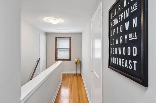The upper level offers a bright and welcoming landing with natural light, hardwood floors, and easy access to the home's private bedroom space.