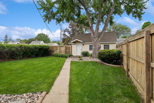 This backyard isn't the product of photo editingâit's the product of exceptional care. From the beautifully maintained lawn and mature trees to the well-kept landscaping and sprinkler system, every element reflects the love owners have invested.