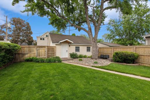 Step into your own private backyard retreat. Surrounded by mature trees and enclosed by a full privacy fence, this beautifully maintained outdoor space offers the perfect setting for summer barbecues, morning coffee, and evenings under the canopy