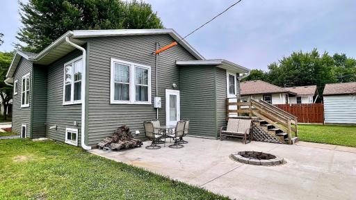 Back view of home. Generously sized patio and fire pit added to home in 2021.