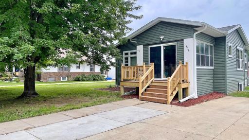 Front of home enters into a three season porch for your added enjoyment.