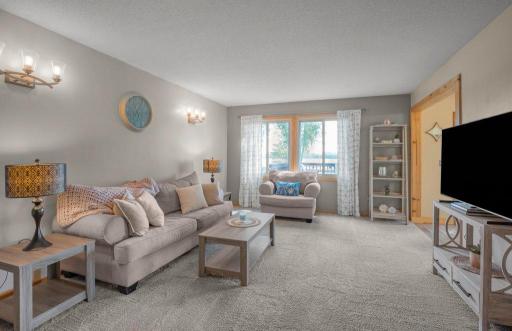 Living room w/ neutral finishes make it light & bright!