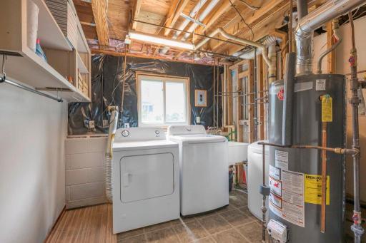 Laundry/Utility room w/ extra room for storage