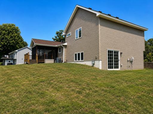 Coming Soon - Showings scheduled to begin Tuesday, July 14th!
Walk-out patio doors from the finished 3rd level, PLUS checkout that screened porch!
