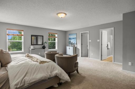 The primary bedroom is a spacious retreat with a sizable walk-in closet!