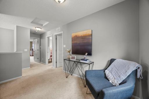 Versatile landing space that works well as a reading nook, office, or lounge.