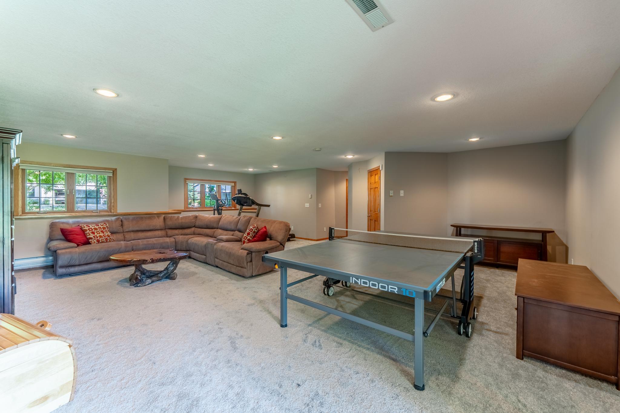 The basement boasts a large finished room that is perfect for movie nights, a game table and still room for exercise equipment.