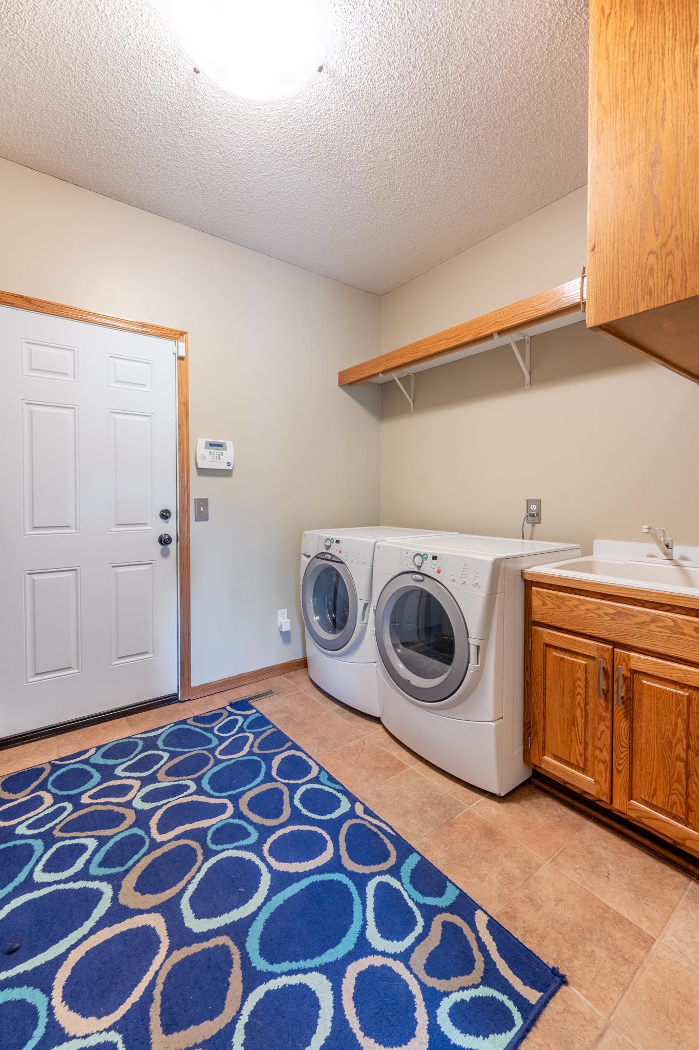 Also on that level is the laundry room with access to the large, 3-car garage.