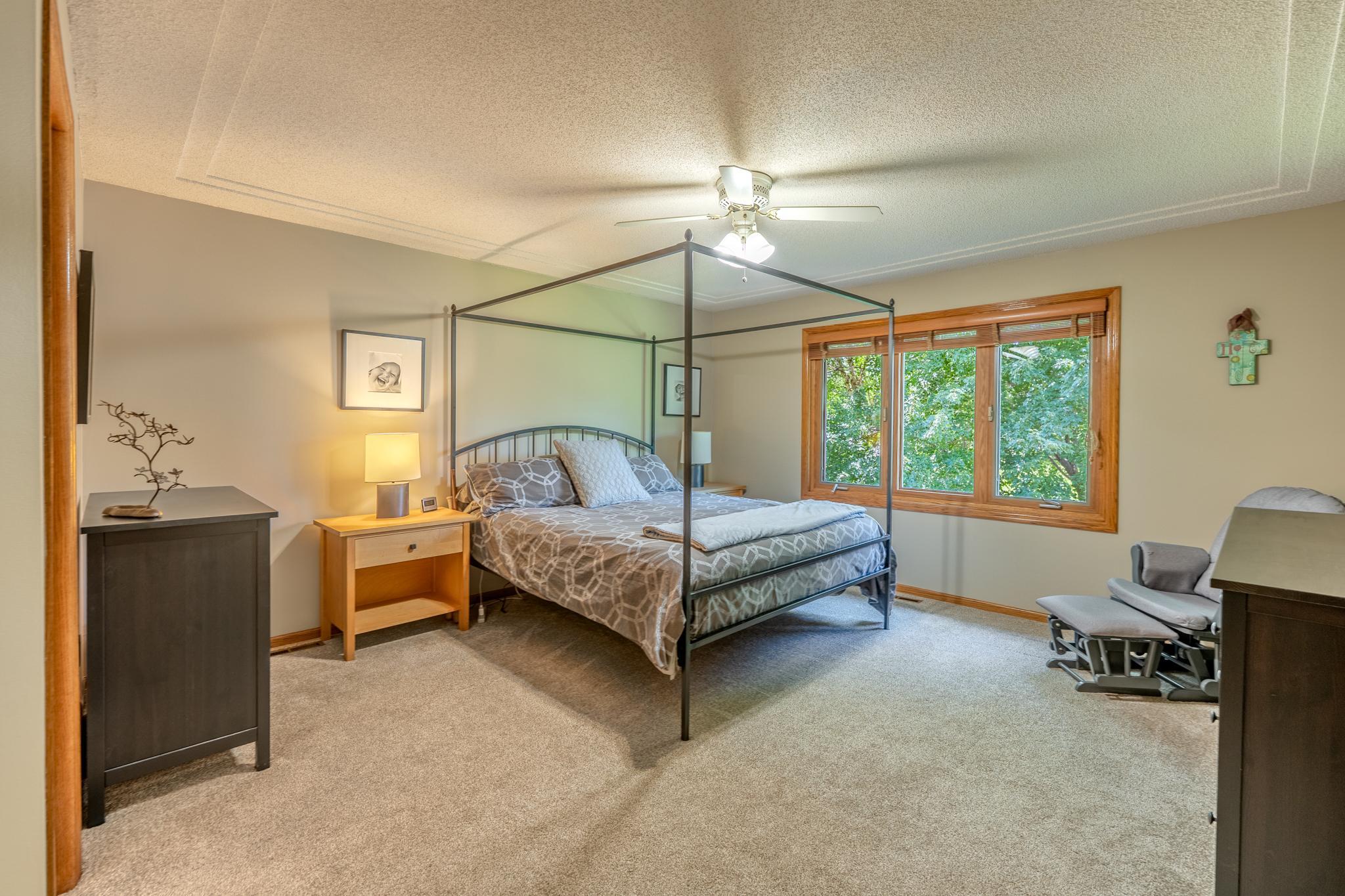Upstairs, the owner's suite is spacious and the windows overlook the private backyard and green space beyond.