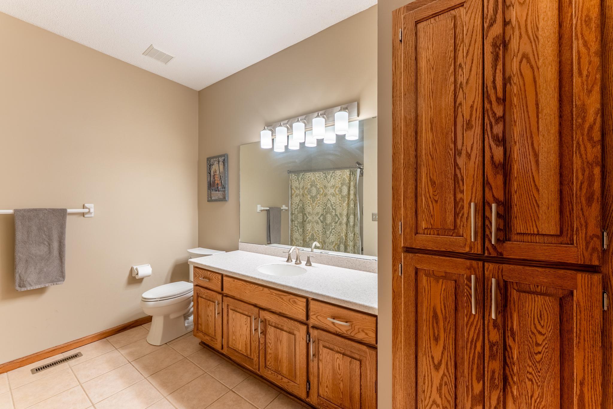 Full bath in lower level includes plenty of storage.