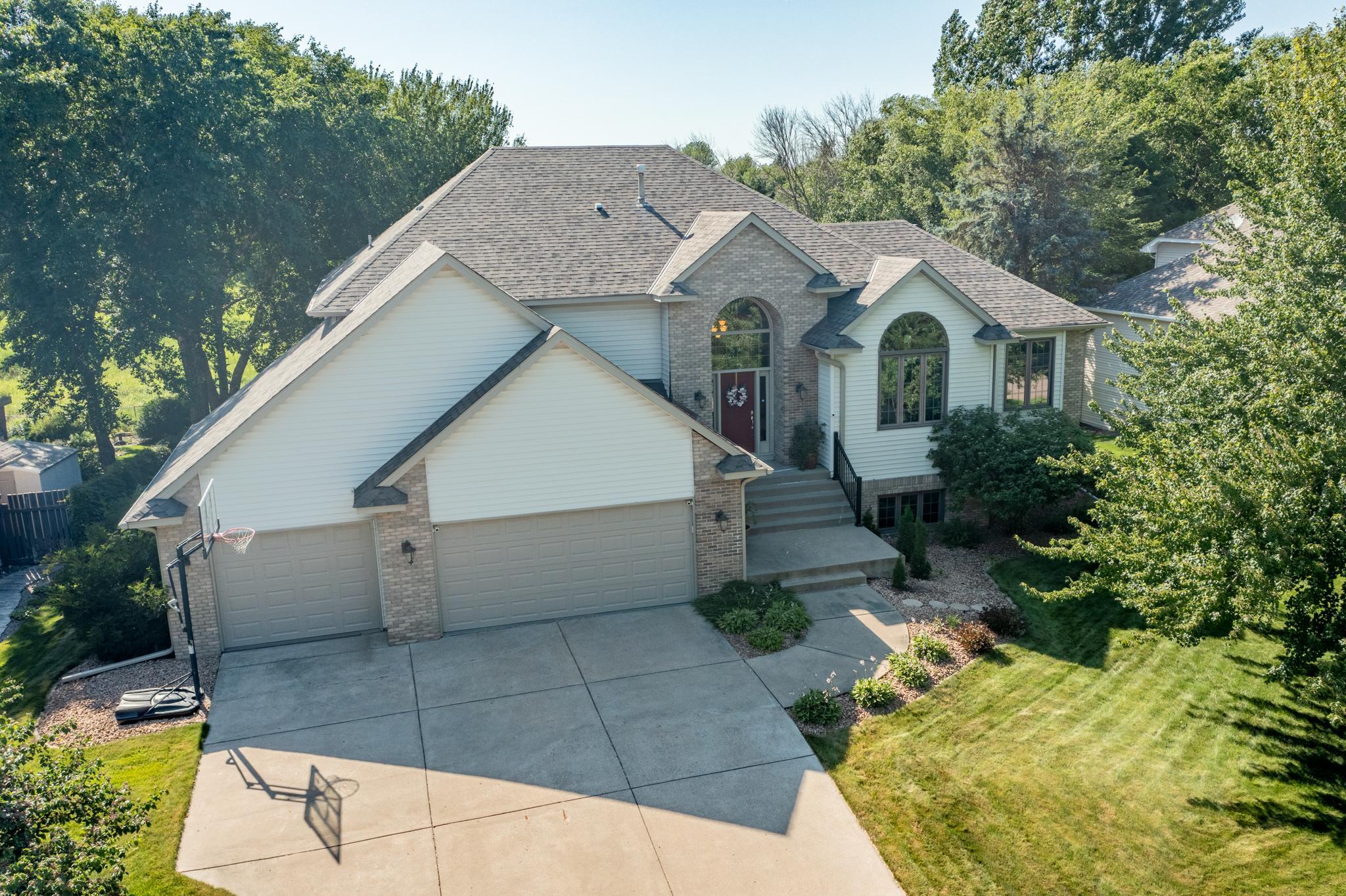 This home boasts fantastic curb appeal, with mature landscaping and plenty of driveway space, and the finished 3-car garage has room for your cars and toys.