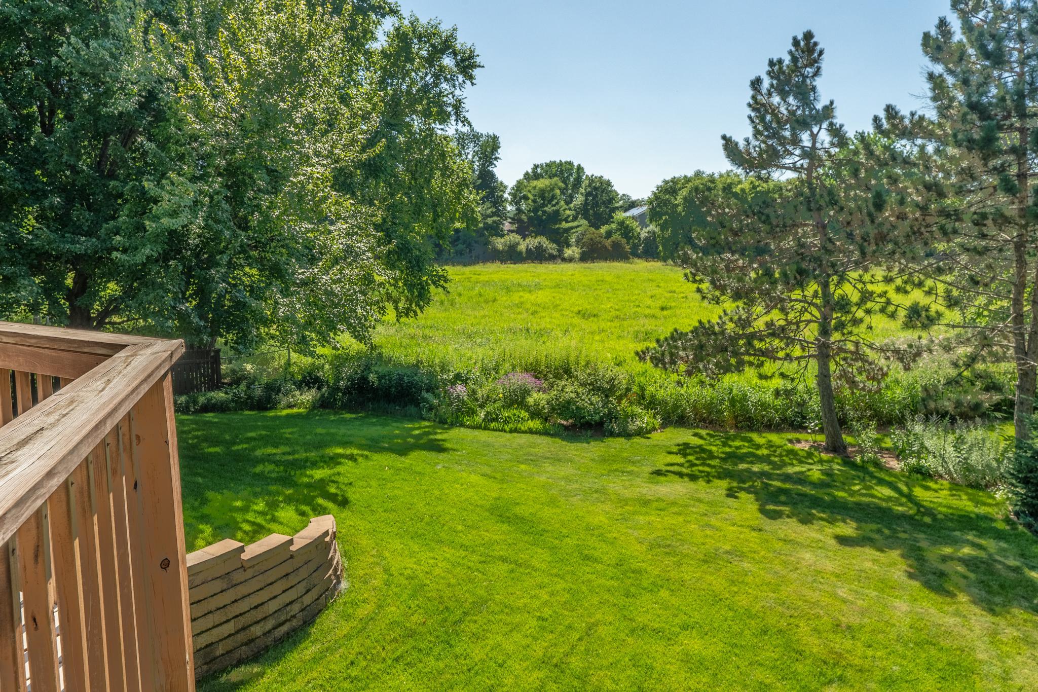The view from the deck of the backyard. The garden boasts honey berry bushes, gooseberries, red abs, white currents and rhubarb. Enjoy berries from your own garden April through July.