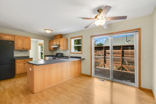 Dining area opens directly to the private side deck for seamless indoor-outdoor living.