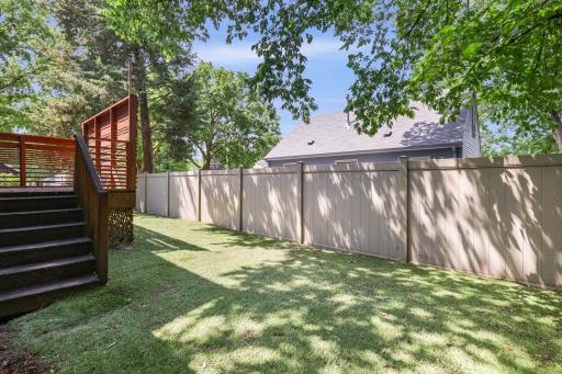 Enjoy a private, fully fenced yard with maintenance-free turf.