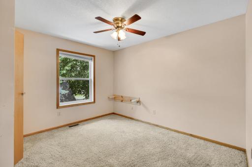 Bright second bedroom with ample closet space.