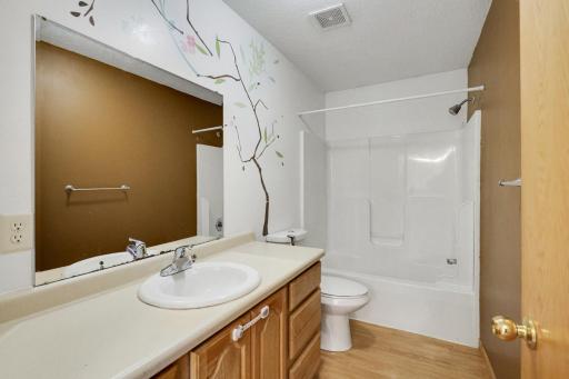 Spacious and convenient full bath serving the second and third bedrooms.