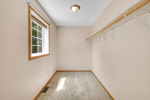Spacious walk-in closet with ample storage.