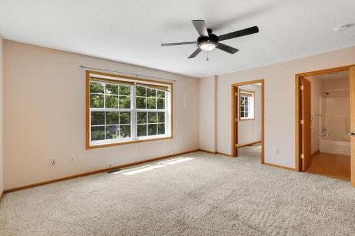Spacious primary suite with an en suite bath and walk-in closet.