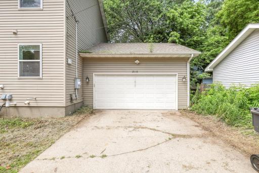 Attached two-car garage with additional storage space.