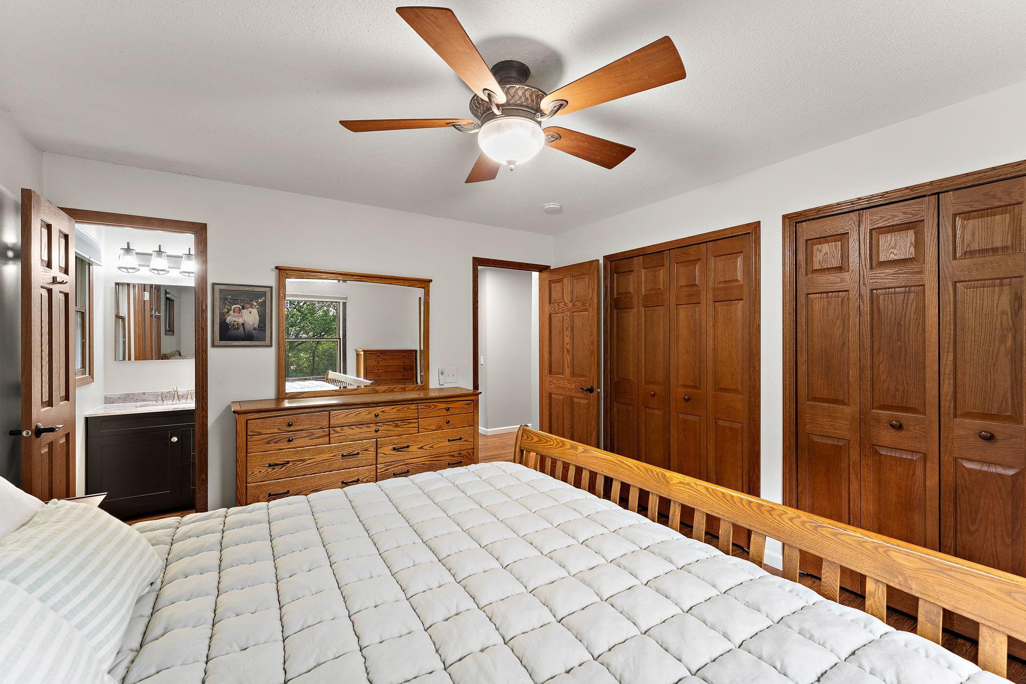 Primary bedroom with double closets and 3/4 bath