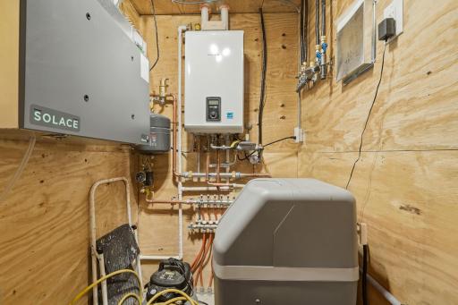 Updated mechanicals including tankless water heater, in-floor heat and water filtration system