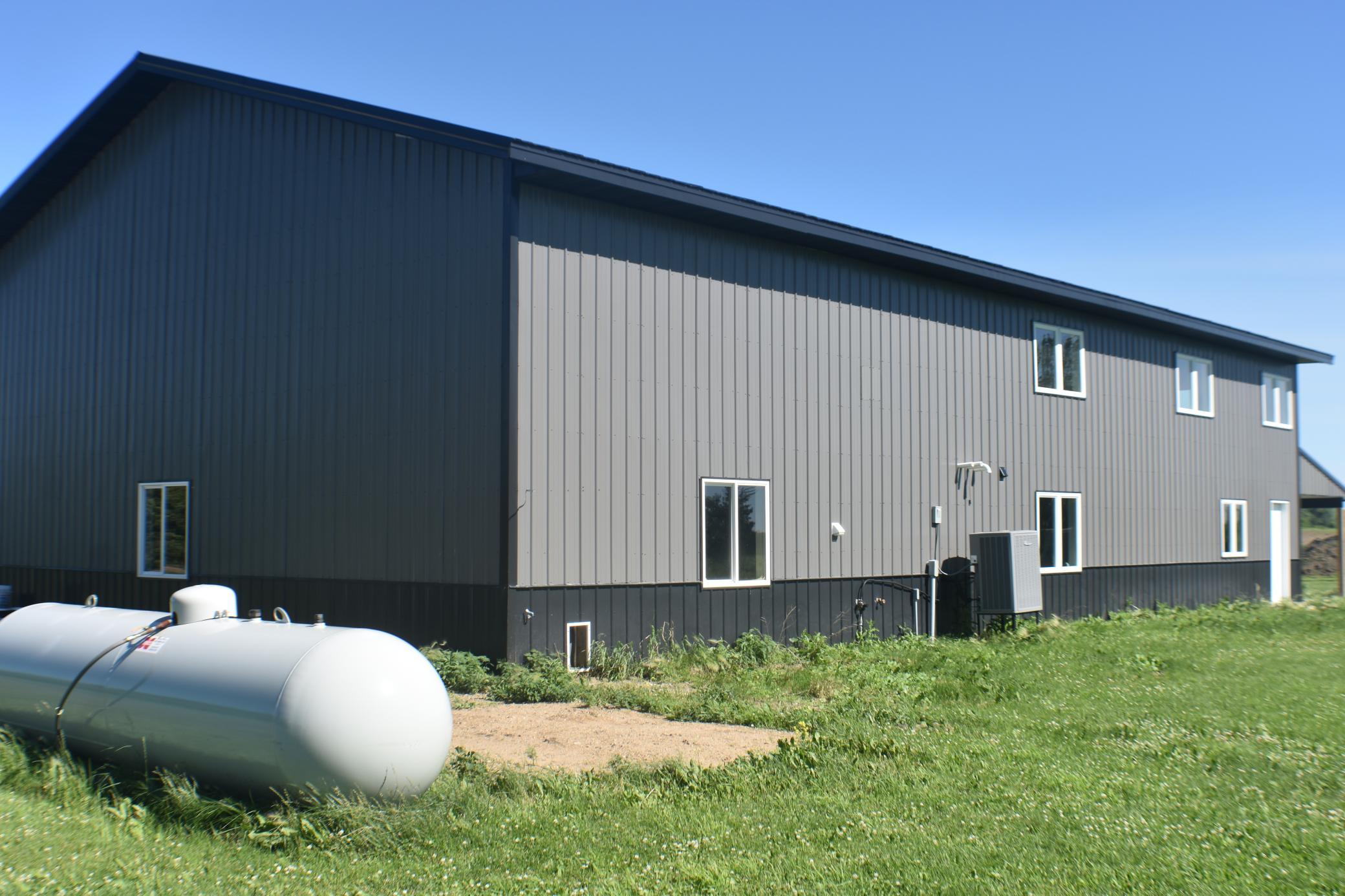 1000 gallon propane tank Pet door in back of garage.