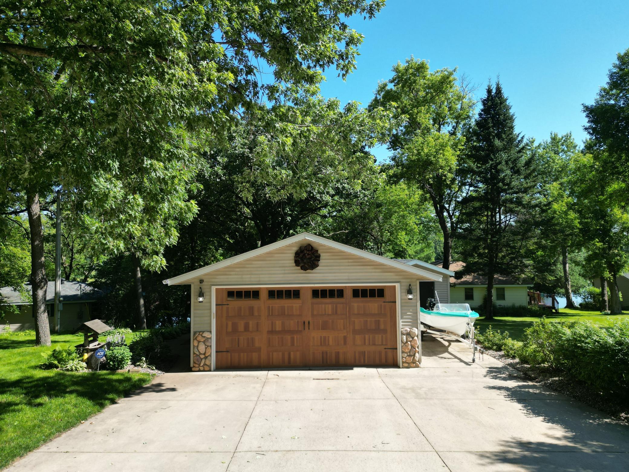 Great concrete driveway serving the garage and shed.
