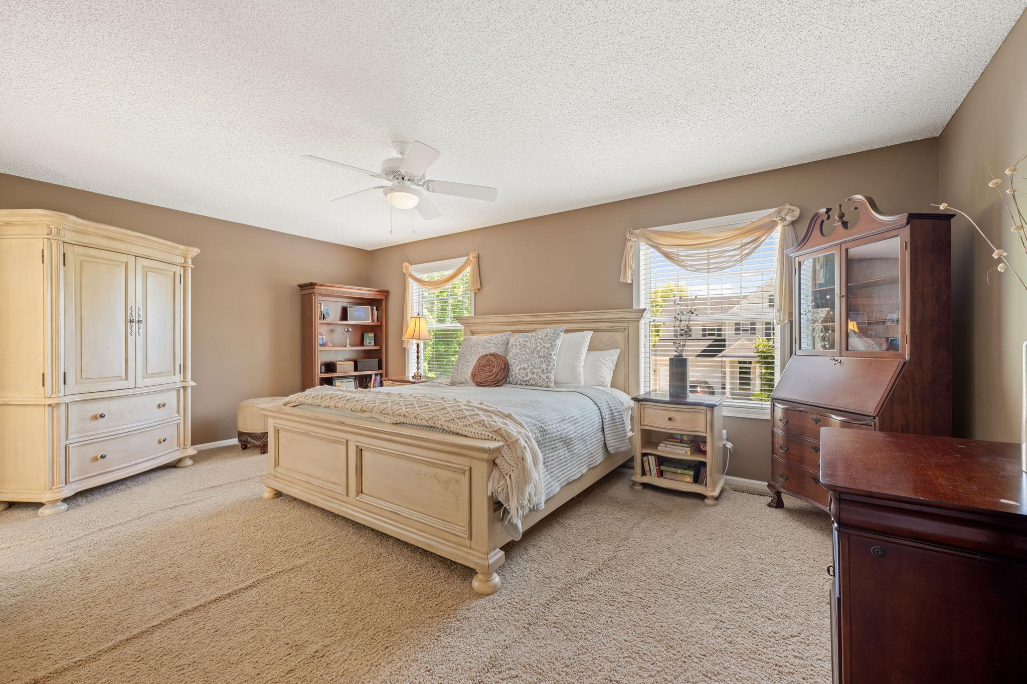 The primary bedroom is a true retreat with a spa-like ensuite bath and walk-in closet.