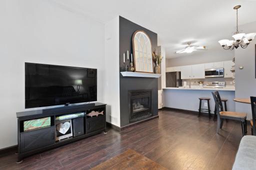 Gas fireplace and mantle are the centerpieces to the living room
