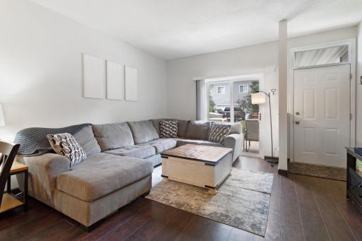 Open living space with a sliding patio door, many of the units in this development do not have the slider access to their patios