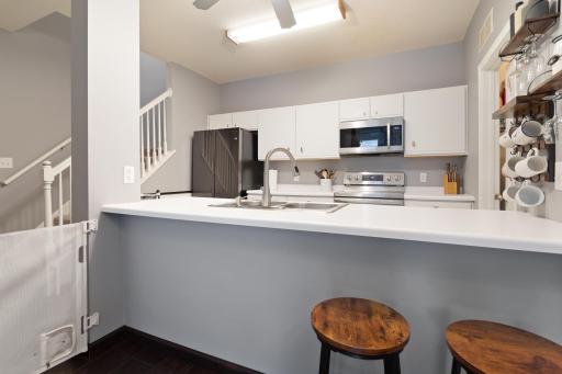 Kitchen eat up bar is a great spot for a quick snack or for extra guest seating!