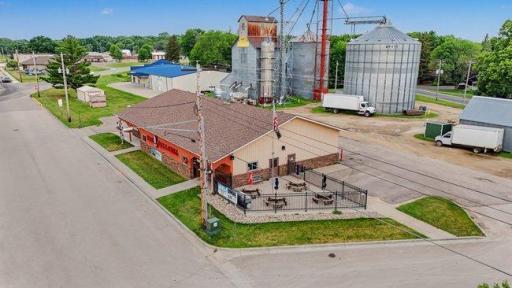 Situated on nearly an acre, this property offers ample parking and significant room for future expansion