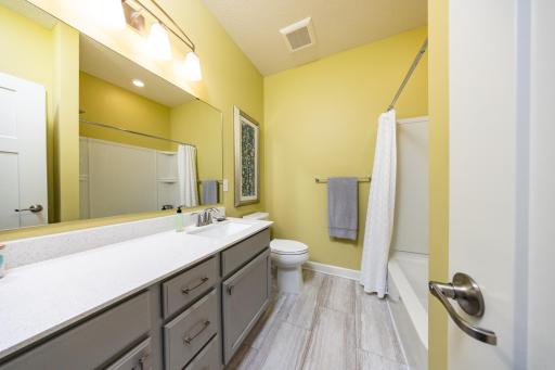 Main floor full bathroom thoughtfully placed between the second and third bedroom