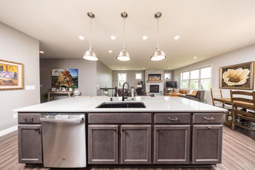 The expansive kitchen island encourages conversation while remaining highly functional