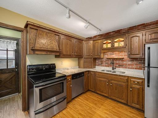 Kitchen w/ granite countertops and stainless steel appliances