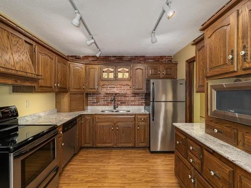 Kitchen w/ granite countertops and stainless steel appliances