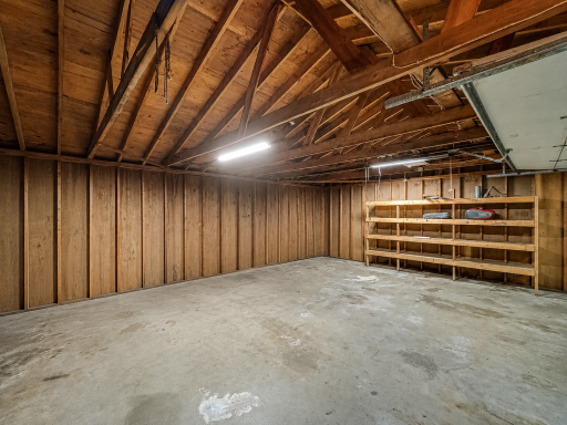 Back attached garage space with separate garage doors and service door