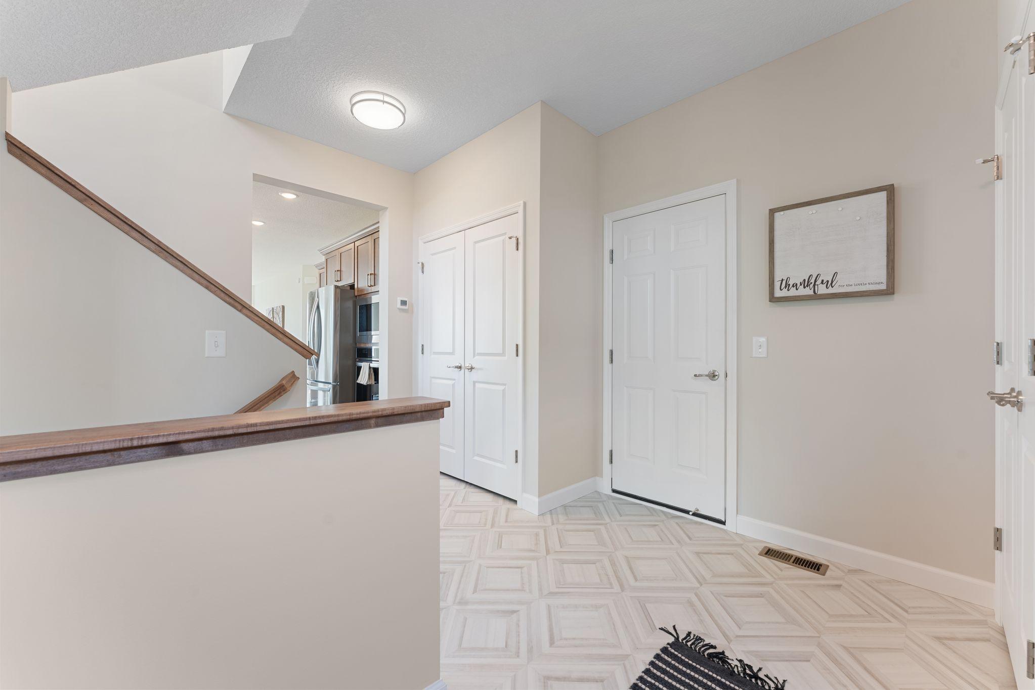 Great pantry storage tucked just outside the kitchen