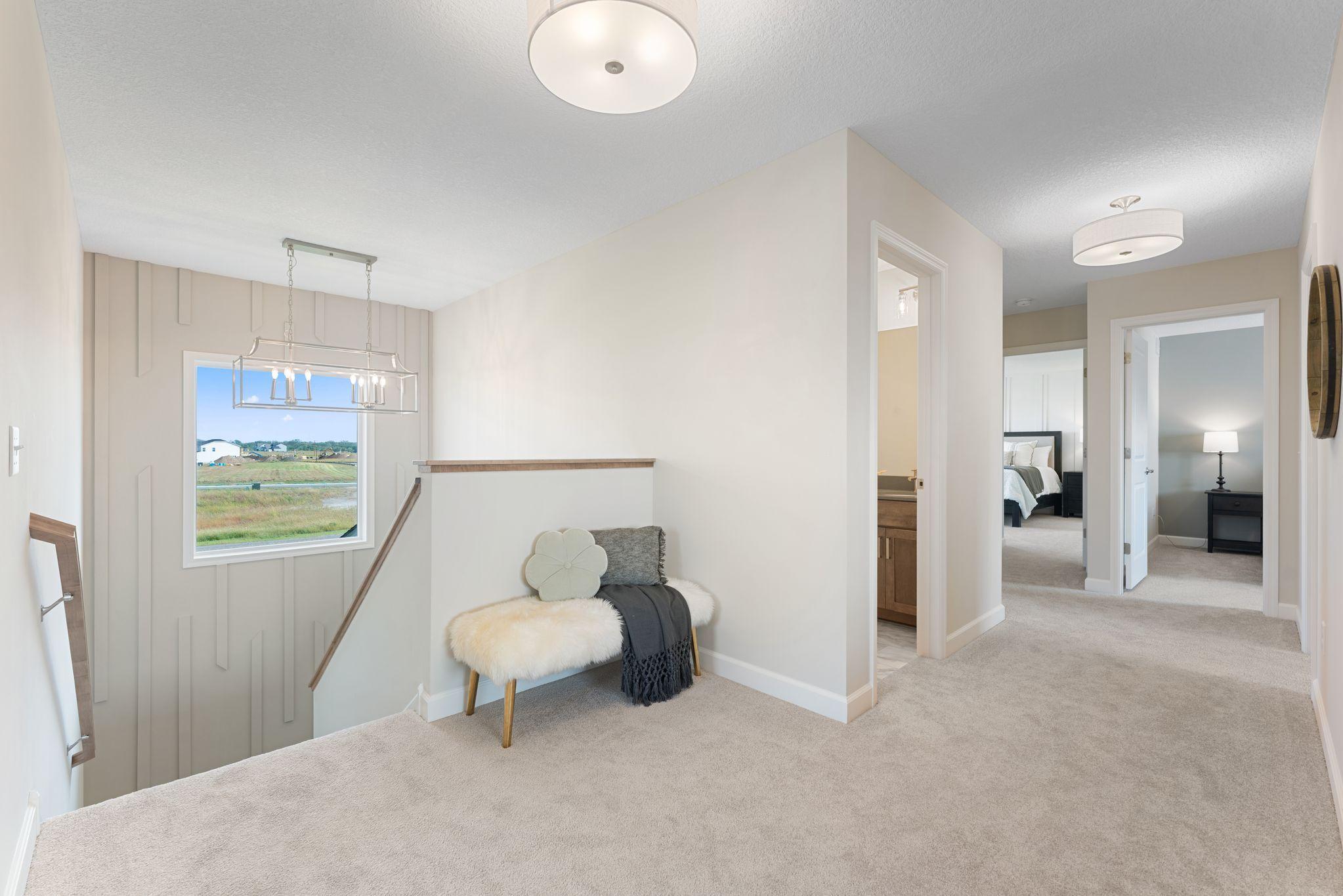 Upper level landing. Great use of space for sitting area or desk for homework/crafts