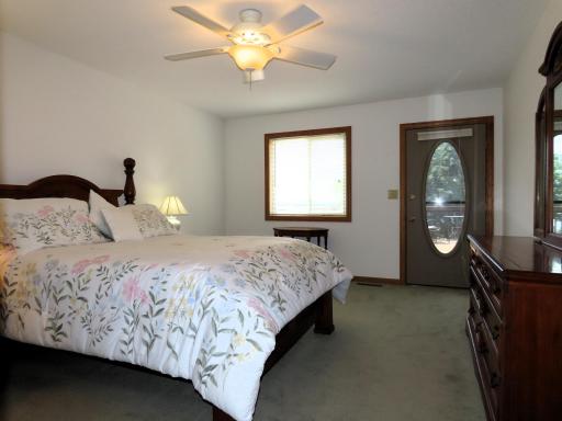 Primary bedroom with a door to the massive deck!