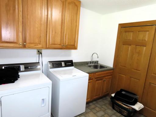 Laundry room with sink and a large closet!