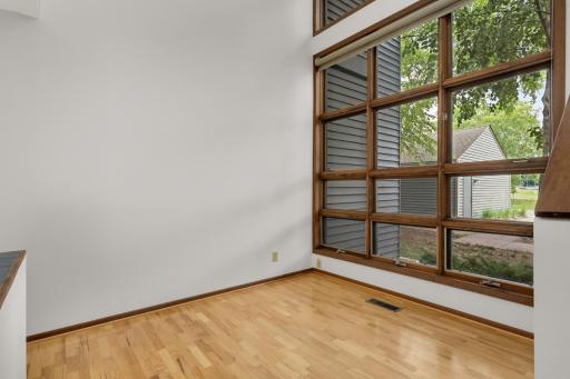 Sunroom with a wall of windows