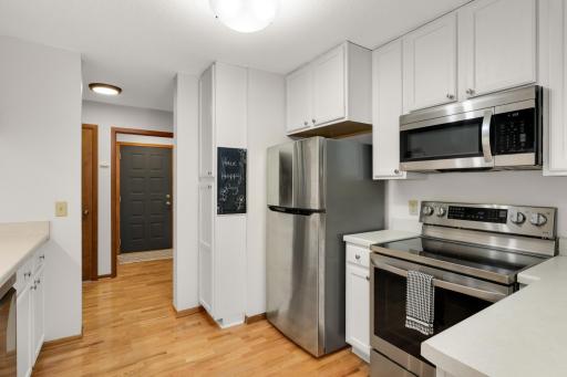 A spacious kitchen with plenty of cabinets and stainless steel appliances