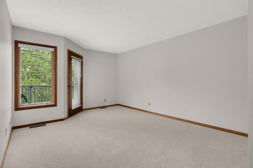 Primary bedroom with new carpeting and fresh paint