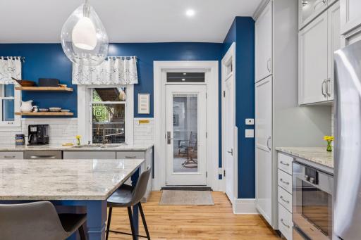 Glass door and transom maximize west light for longer afternoon sun