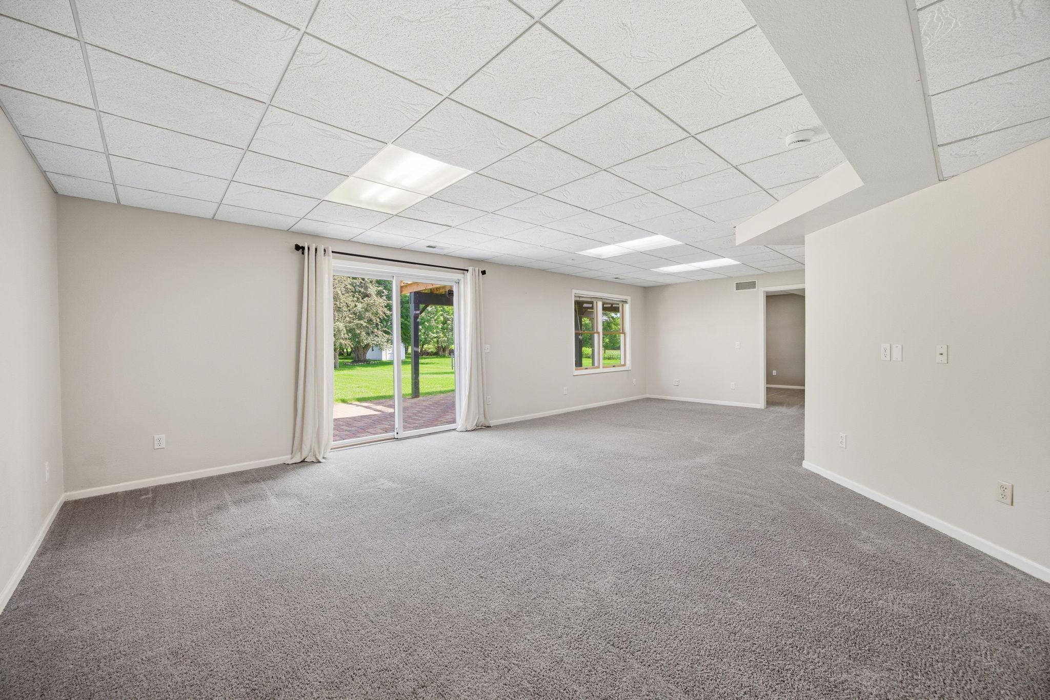 Family Room Lower Level 14325 Quince St NW Andover.jpg