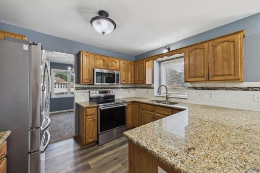 Kitchen with granite counters and new appliances