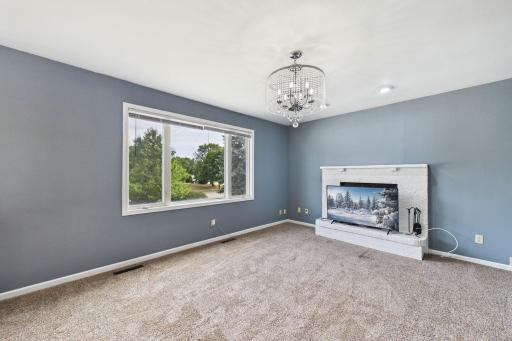 Family room with wood burning fireplace