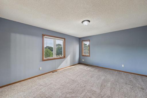 Another view of the primary bedroom