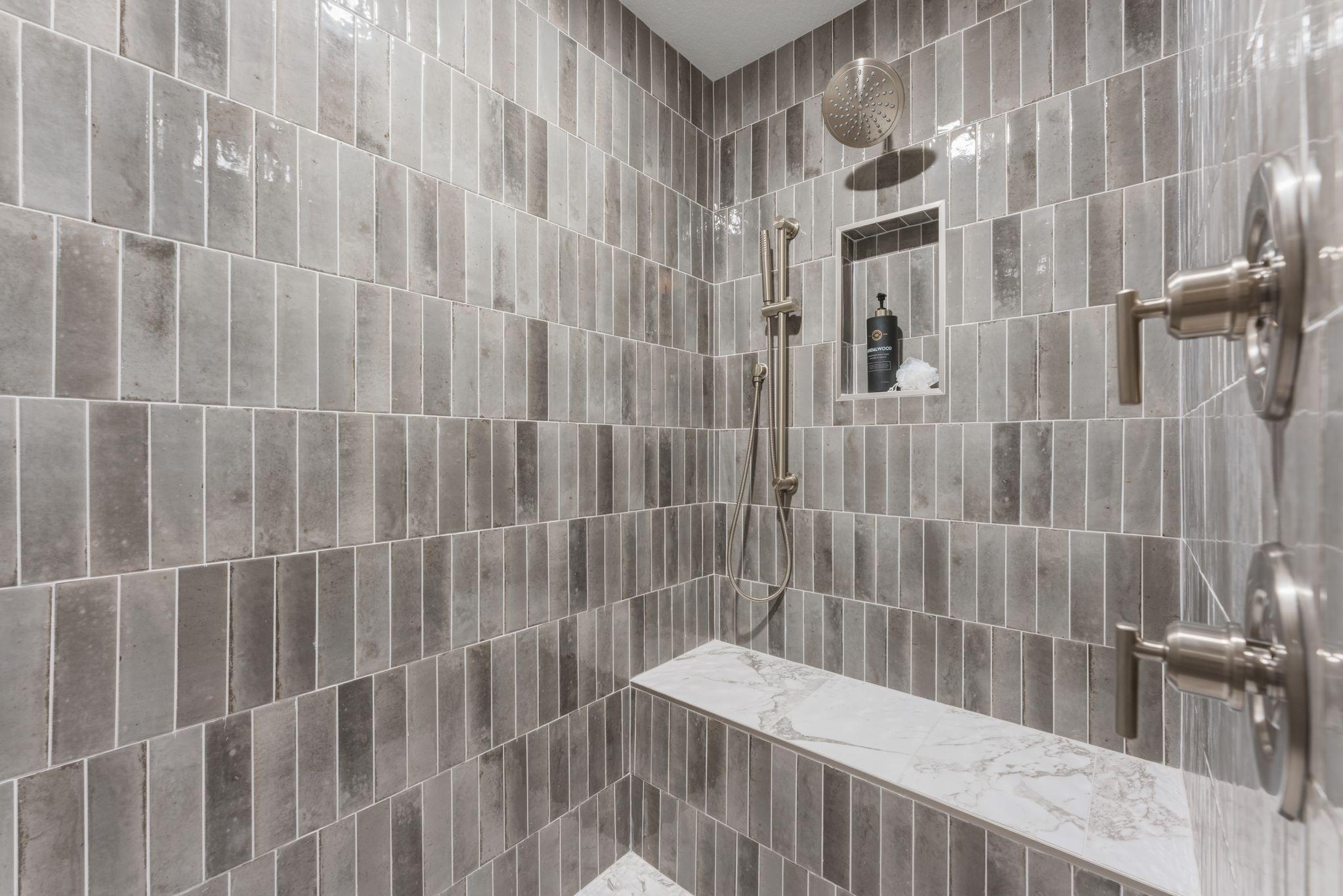 Fully tiled walk-in shower with bench